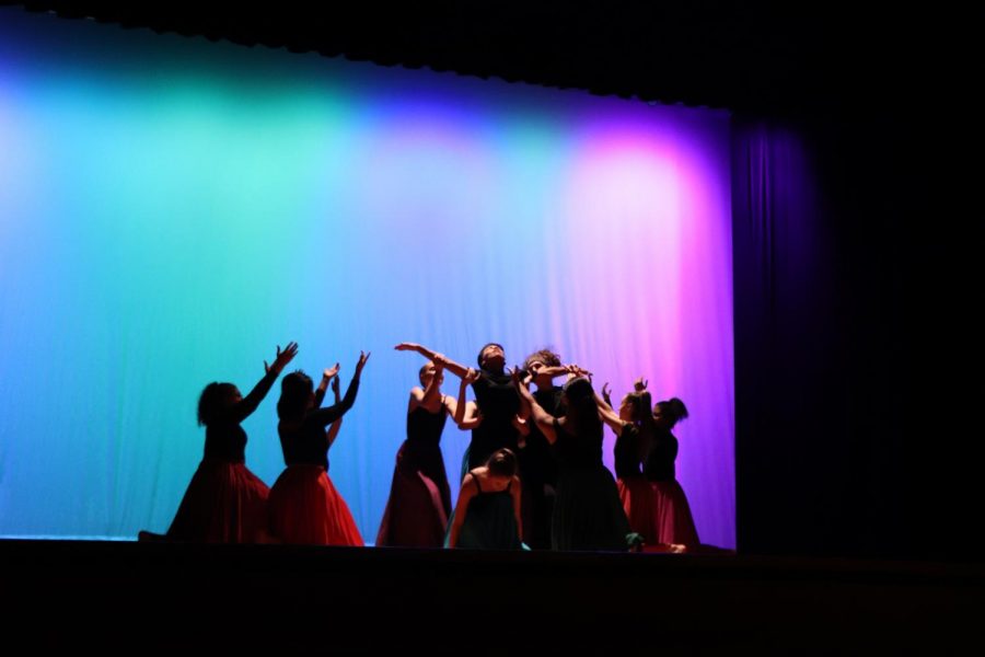 Dance Ensemble lifts up junior Oziel Valdez during their dance, Orinoco Flow.