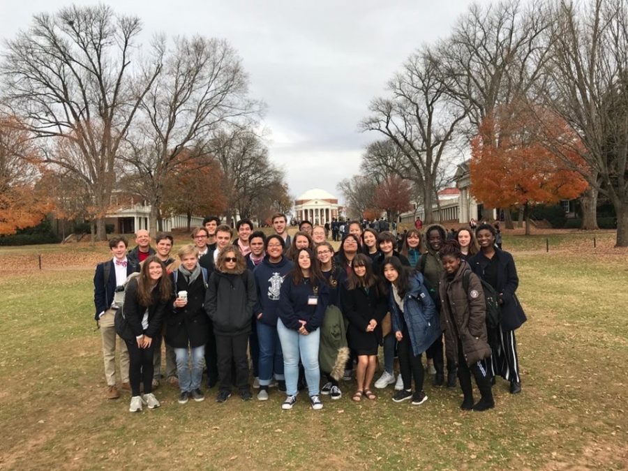 Students attend the Model UN conference and take a picture in front of the Rotunda. 
