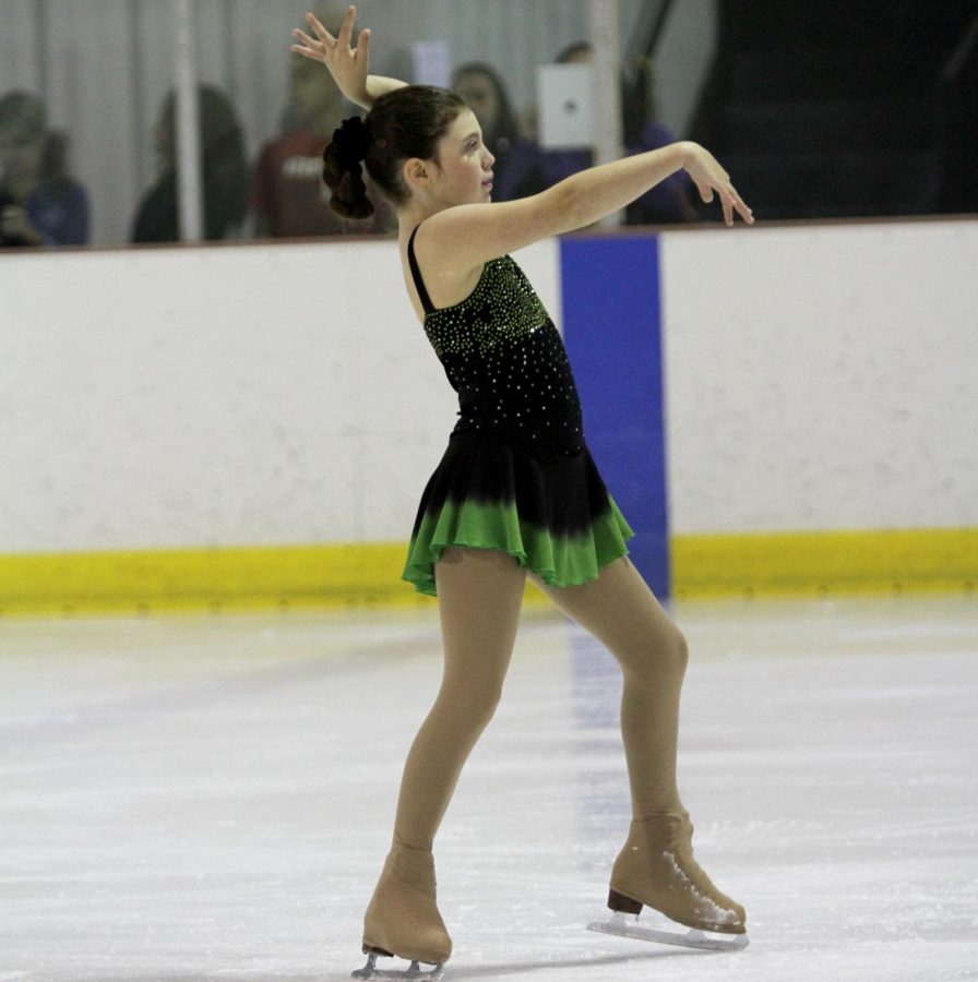 Grace Miller performs a figure skating routine as a child. 