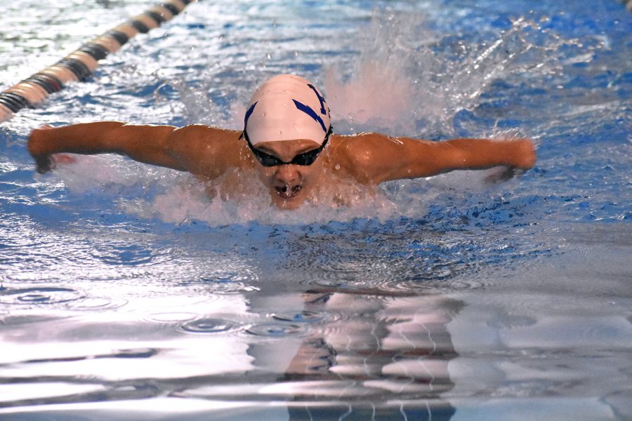Freshman Noah Gabriele swims the 100 butterfly. Gabriele placed first overall with a time of 1:02.25. 