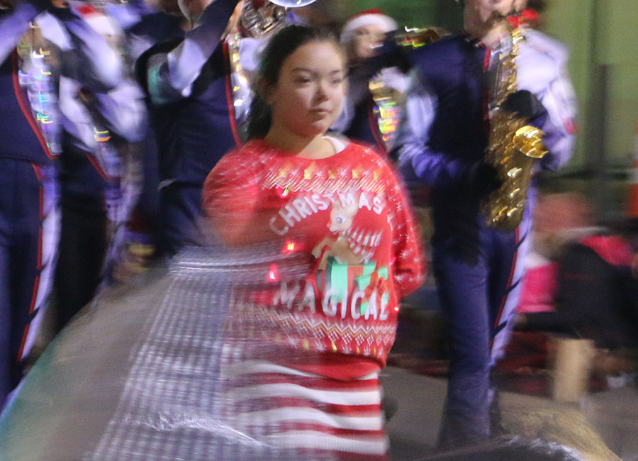 Freshman Samantha Syharath, leads the band together with the color guard. 