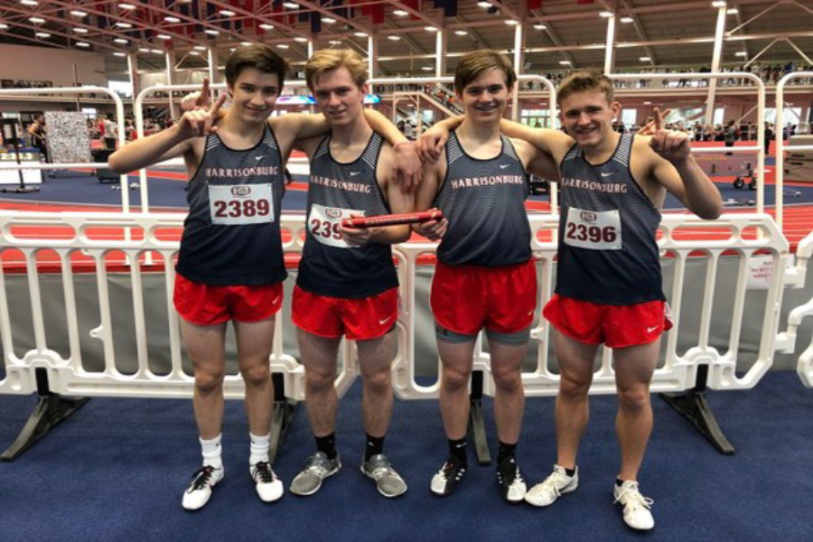 The 4x800 boys indoor track team celebrates after breaking a school record Jan. 4 at the Bulldog Invitational at Liberty University with a time of 8:12.25