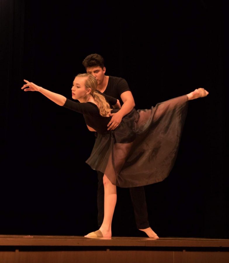 Senior Claudia Obenschain preforms for her dance 4 honors project with her partner senior Winston Lobo. 