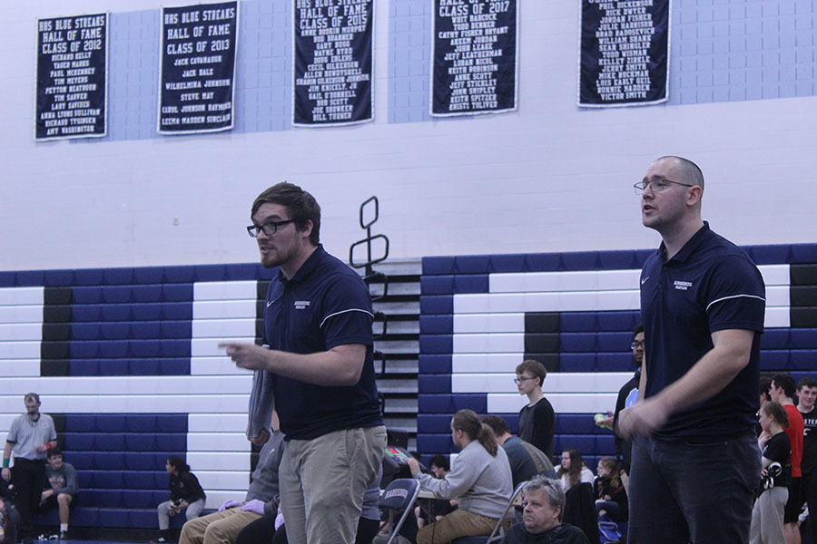 Coaches Billy Bower and Josh Smoot direct Anttwone Washington during his match.