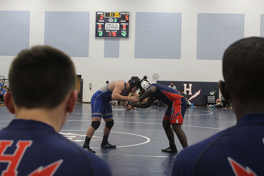 Junior Anttwone Washington fights for wrist control during his match against a Spotswood wrestler. The wrestling team had a match Jan. 15, 2020. The schools that participated were Spotswood, Broadway, Turner Ashby, East Rock and Harrisonburg high schools.  