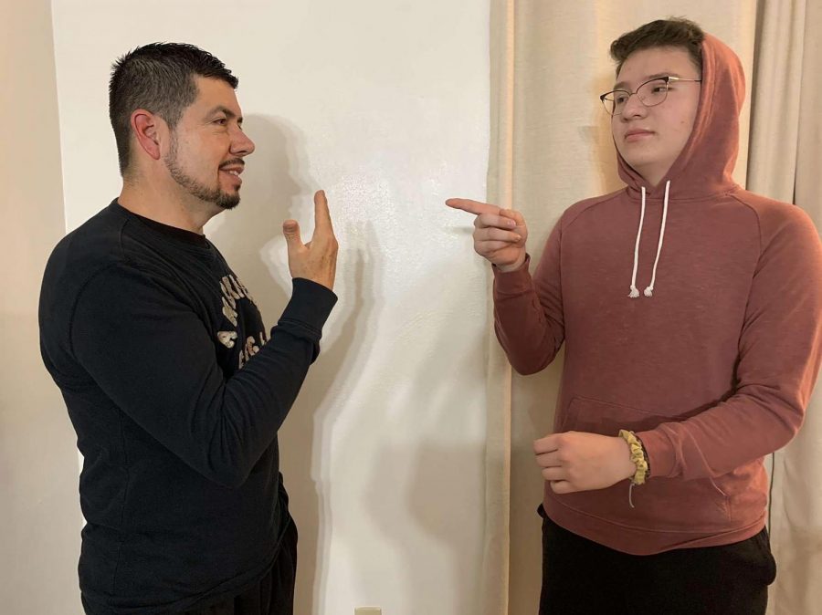 Junior Jesus Cortes communicates with his father using Spanish Sign Language. 