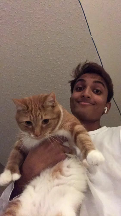 Junior Sid Tandel holds his cat, Squeaky. I like Squeaky because hes really nice sometimes but he also leaves me alone when I dont want to deal with him. Hes also a Hemingway cat so he has cute little thumbs, Tandel said. Tandel prefers cats since they are less messy and needy overall.