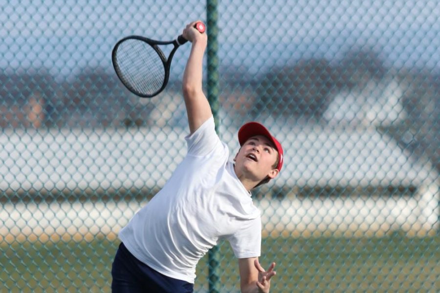 Freshman Corey Beshoar competes in a tennis scrimmage prior to the season being cancelled.
