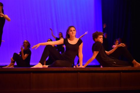 Freshman Ella Young poses with junior Javion Green during a dance performance at HHS.