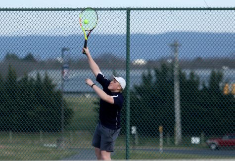 Sophomore Adam Osinkosky serves the ball in his match as the three seed against Fort Defiance. The end score for this match was 10-4 Harrisonburg.