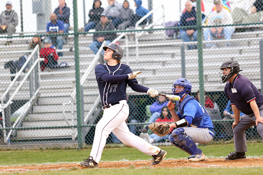 Senior Tristan Fink swings at a ball during Harrisonburgs game against Spotswood High School in the 2019 season. The streaks went on to win the game 7-4. 