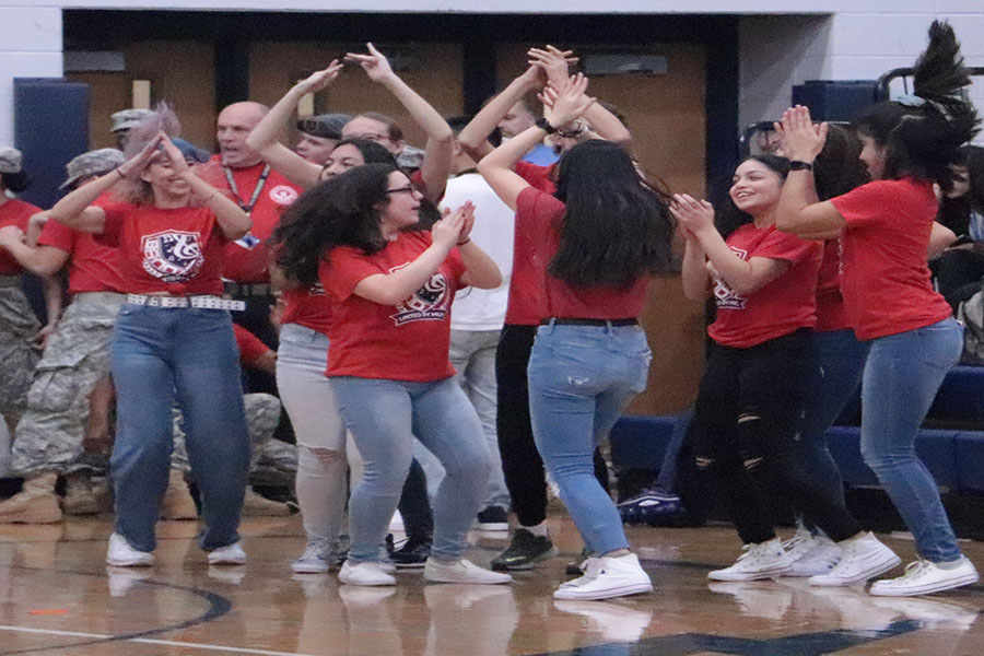 Students in band, dance to the music during the pep rally.