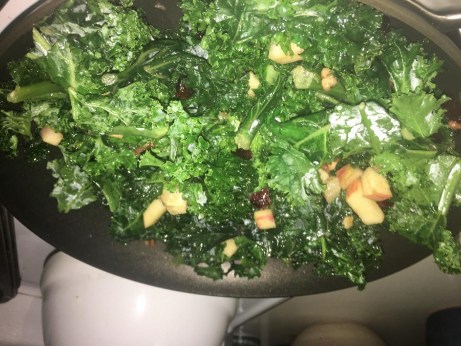 Step 3: Once the kale begins to shrink, combine the rest of the ingredients and top with pecans. 