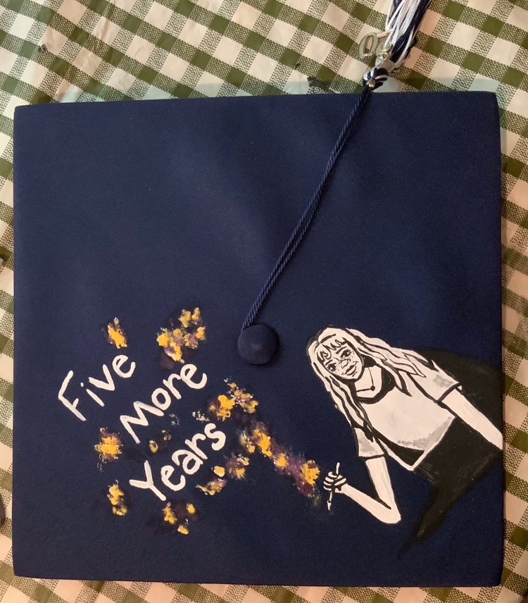 Senior Faith Evans-Haywood designed her cap to represent a five year art teaching program she will be pursuing at James Madison Universty.
