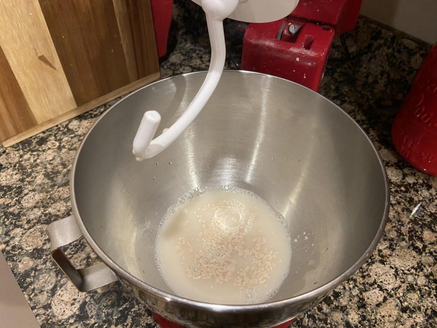 Proof your yeast in the warm water in the bowl of a stand mixer. The recipe calls for active dry yeast, but instant yeast also works well.