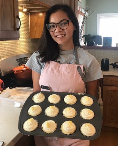 Junior Sophia Yoder shows off fresh newly baked cupcakes in her spare time. “Baking is something I do to de-stress, and it’s also just a fun hobby. I figured selling the things I bake would be a great way to both do something that I love as well as help raise money for charities,” Yoder said.
