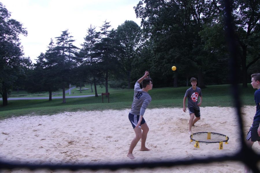 Senior Nathan Brown gets ready to hit the ball into the middle net.