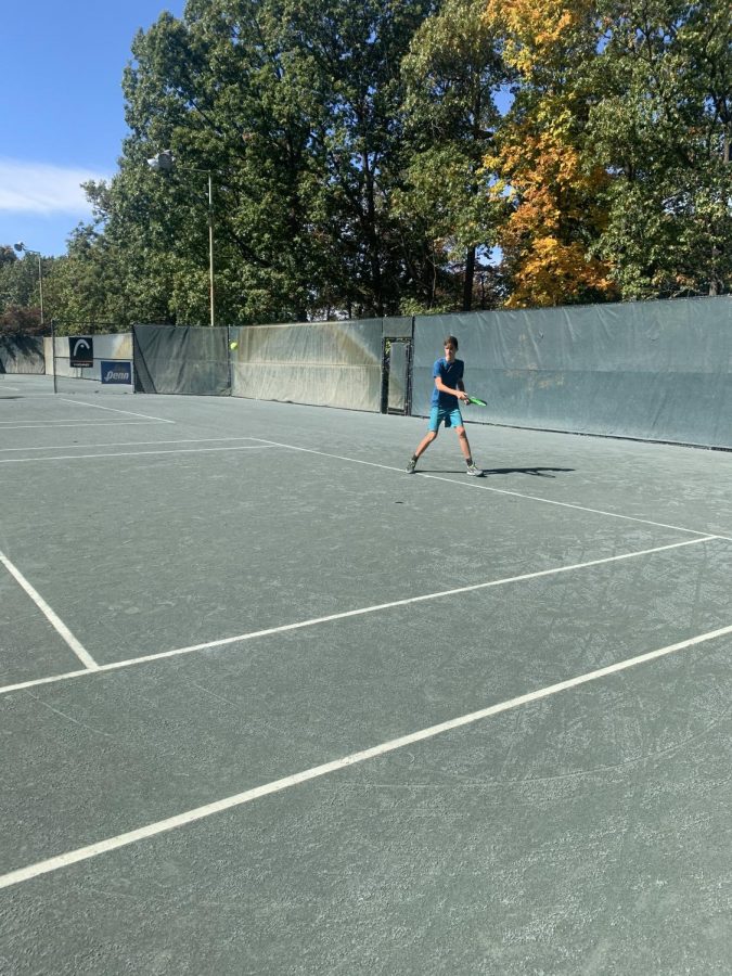 Running to hit the ball. 