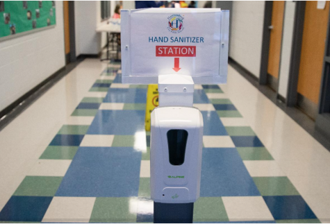 Hand sanitizing stations are set up throughout schools to prevent the spread of COVID-19.