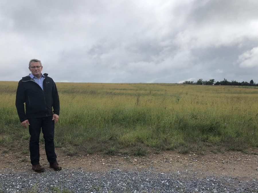 Swayne stands in front of the land where HHS 2 will be built.  