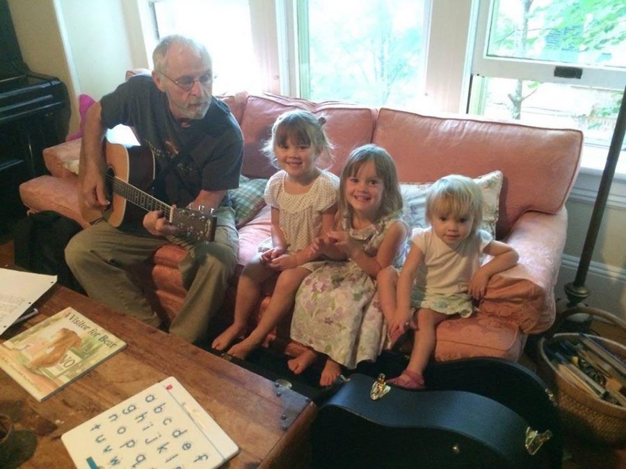 Peckham (left) sings to his grandchildren.