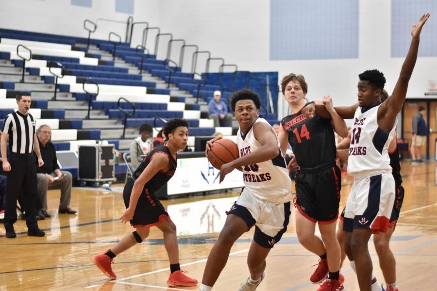 Senior Jazen Walker blows past his defender to go up for a layup during the a home game in the 2019-2020 season. 