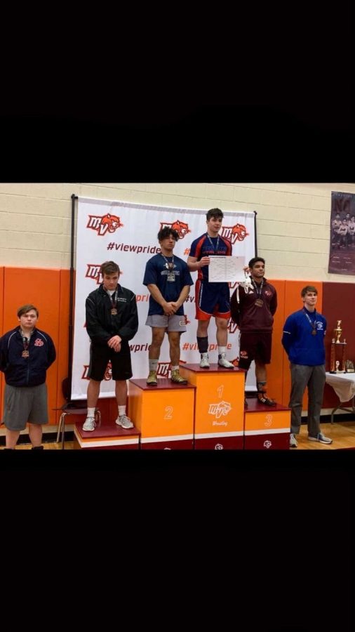 Senior Blake Metcalf stands atop the podium after winning the Mountain View tournament.