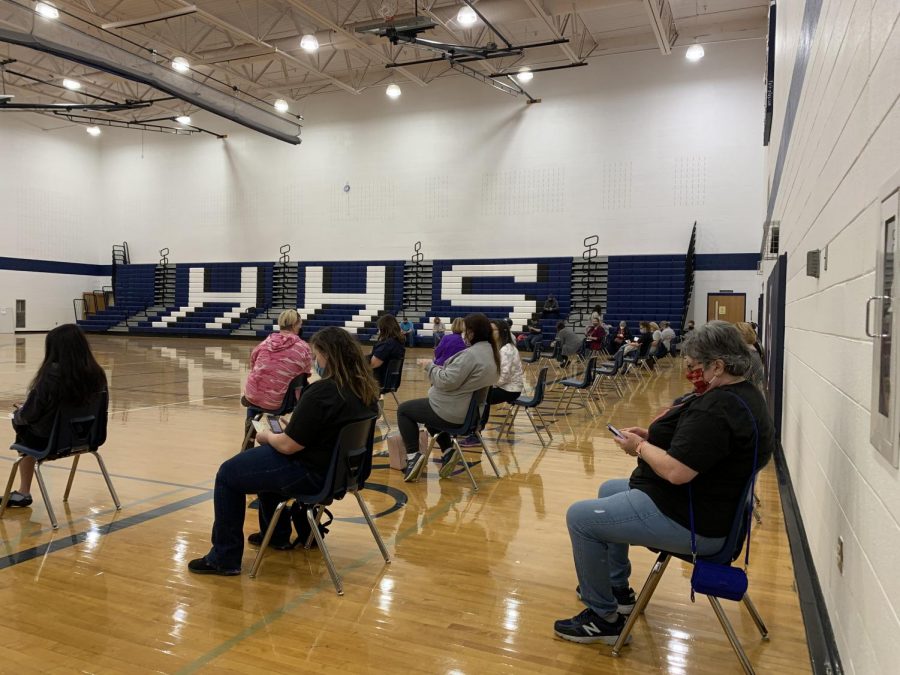 HCPS teachers and staff wait in the gymnasium of Harrisonburg High School for their vaccination. 