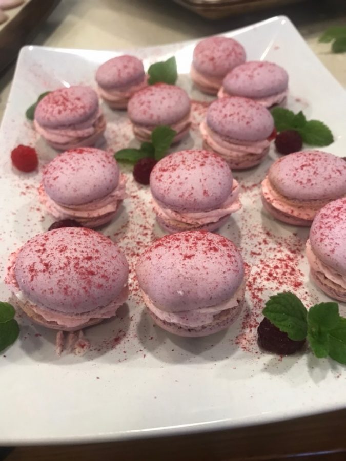 Yoder made these raspberry macarons in October. To win a free cake from Yoder, one can refer seniors to college adviser Anna Du. Whoever refers the most seniors by the end of February wins a free cake.
