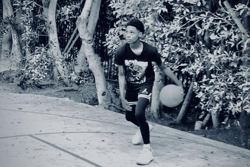 Freshman+Edison+Castro+plays+basketball+outside.+Since+Castro+started+playing+basketball%2C+it+has+provided+him+a+way+to+clear+his+mind.+%E2%80%9C%5BBasketball+brought+me%5D+more+peace+for+sure.+It+made+me+more+calm+as+it+got+my+mind+off+a+lot+of+things%2C+%5Band%5D+it+made+me+more+happy%2C%E2%80%9D+Castro+said.+