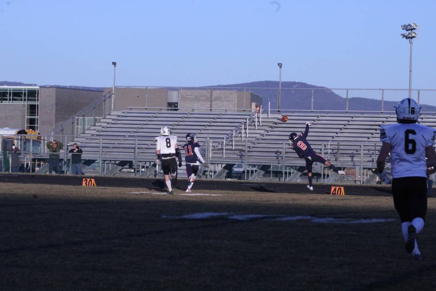 Freshman Braden White tries to catch the ball and make a fast run to advance his team ahead in the game. 