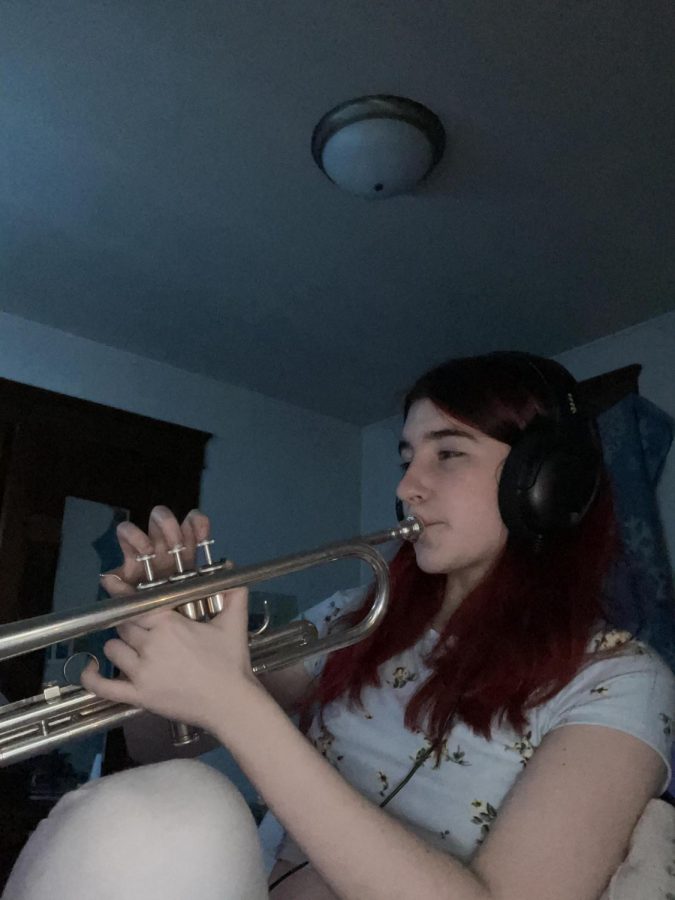 After finishing her homework, freshman Jasmine Lupo practices her trumpet. She practices everyday to master the instrument. “I practice for about an hour everyday because [playing the trumpet] takes time and effort,” Lupo said.