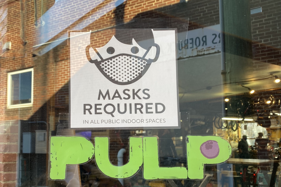Like many other stores downtown, Shenandoah Bicycle Company has signs out front letting customers know they have to wear a mask in the store.