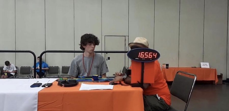 Junior Caleb Fox (Right) attends Rubik’s Cube solving event in Georgia. Fox Ranked in the top 100 worldwide for his solving time. 