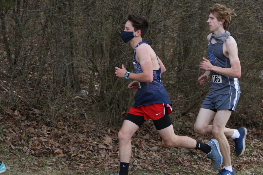 Sophomore Liam Wightman runs during a cross country meet at Thomas Harrison Middle School on March 17, 2021. 