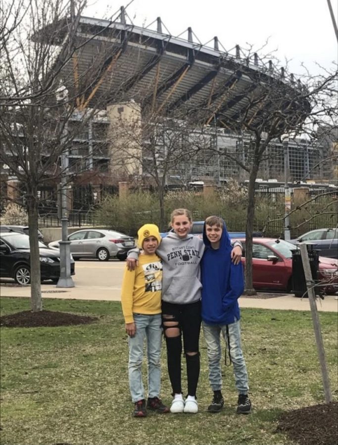 Freshman Aspen Long poses with her brothers who she will be traveling with over Spring Break.