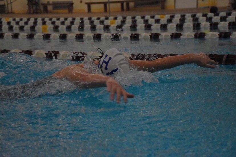 Current senior Maddie McCay finishes her butterfly race in the 2019 swim season. 