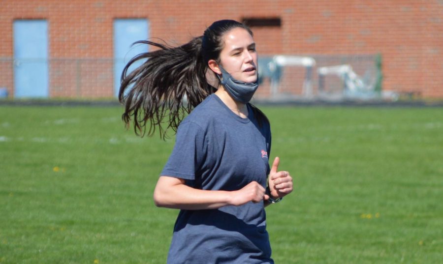 Junior Brigid Banks completes a workout during track practice. Banks got into the hobby of running over quarantine.