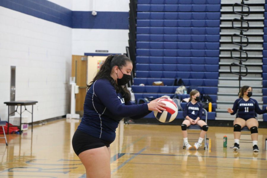 Freshman Marlene Padrone gets ready to serve the ball.