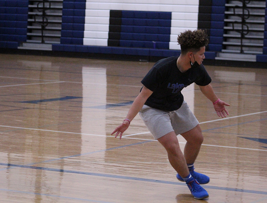Sophomore Kayden Madden works on footwork during tryouts.