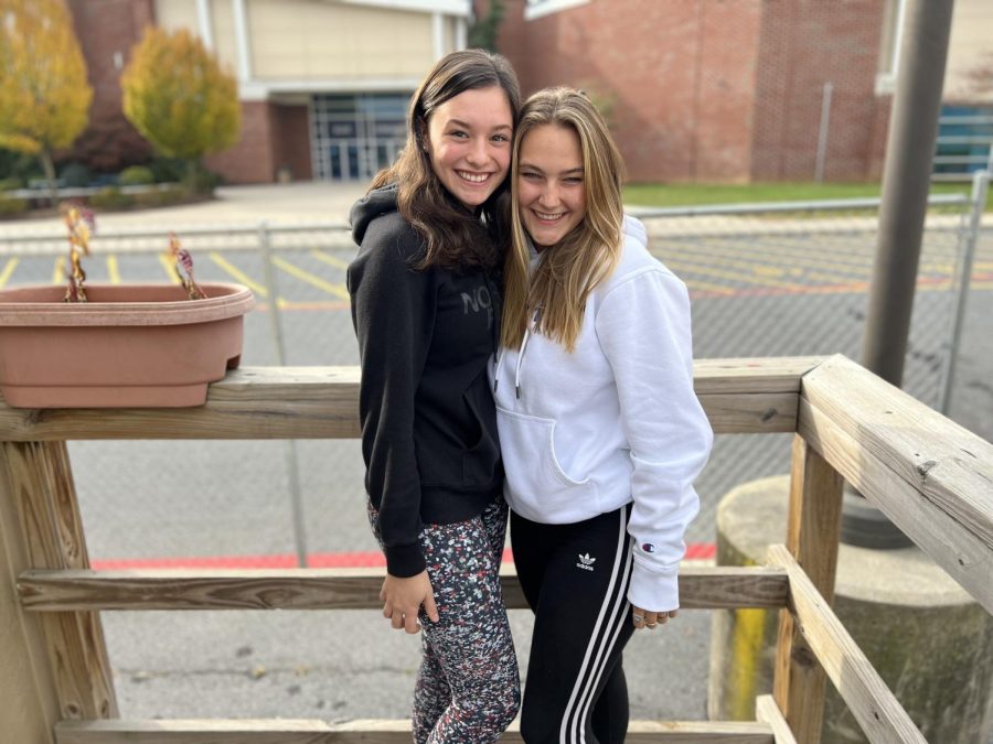 Sophomores Addison Fornadel and Lucy Ludwig pose for a photo outside of their classroom. 
