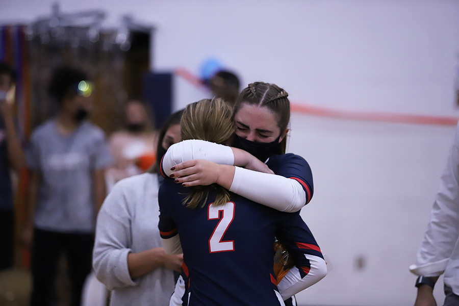 Senior Maya Waid hugs sister freshman Macy Waid. 