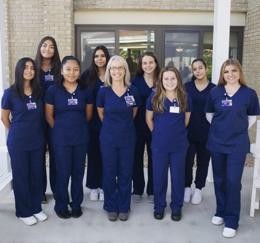 Back row: Seniors Adriana Calles Elias, Fanny Valderramos-Flores, Clara Miller and Maria Torres Moreno. Front row: Seniors Johona Alvarenga Cruz ,Leidi Romero-Velasquez Instructor Tricia Cummings, senior Mia Stewart and senior Ava Rath.