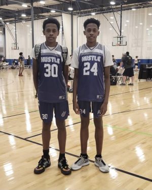 Latham (left) and Tiberius (right) Fields participate in an AAU basketball tournament.