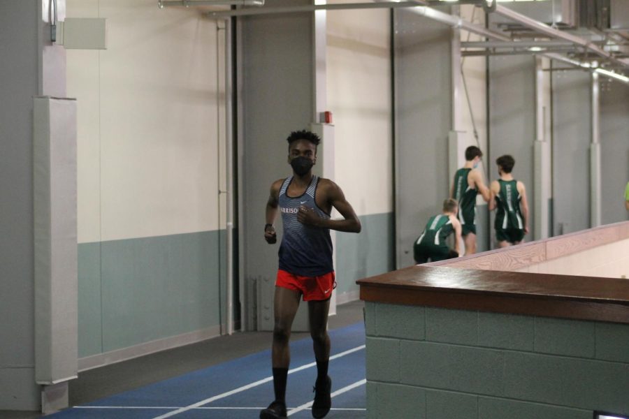 Sophomore Haneef Ogundipe warms up for the 500 meter run.