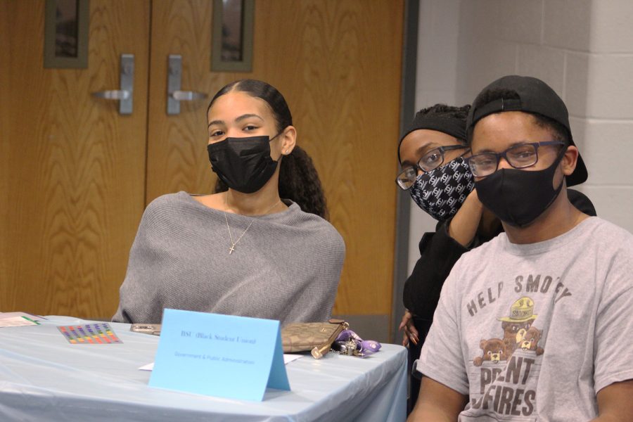 Three students spread awareness of the Black Student Union.