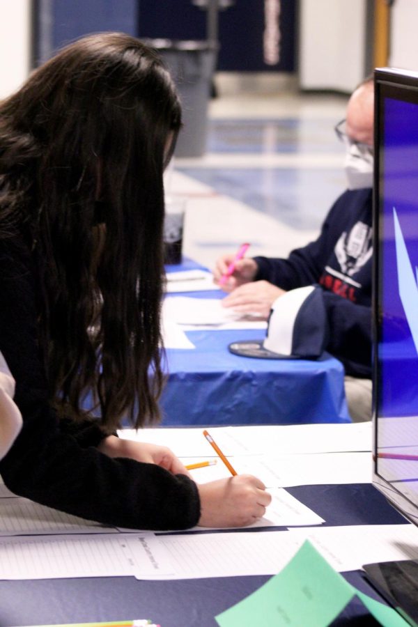 Student signs up for extracurriculars next year.