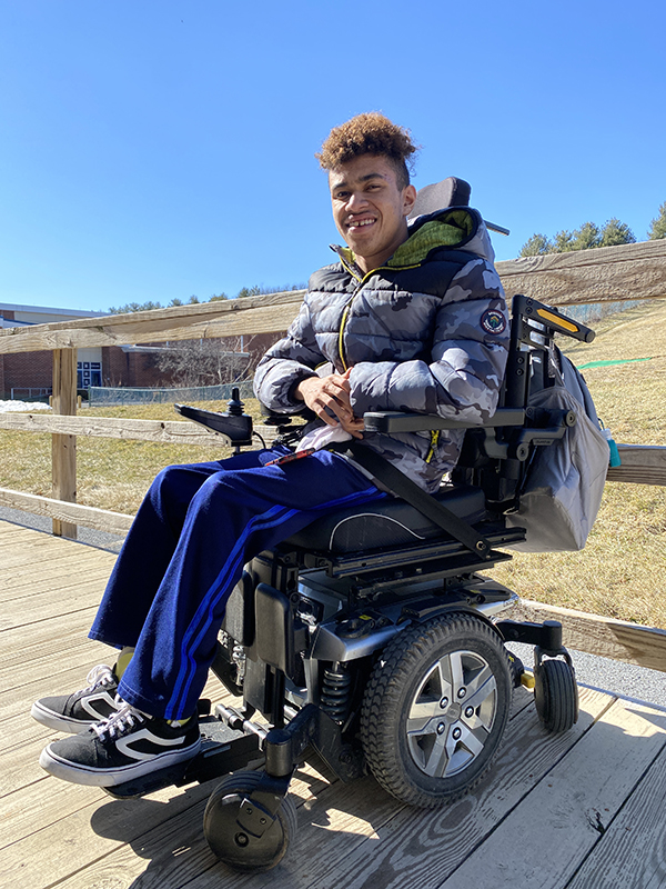 Sophomore Michael Bennett poses for a photo outside of his drivers education classroom.