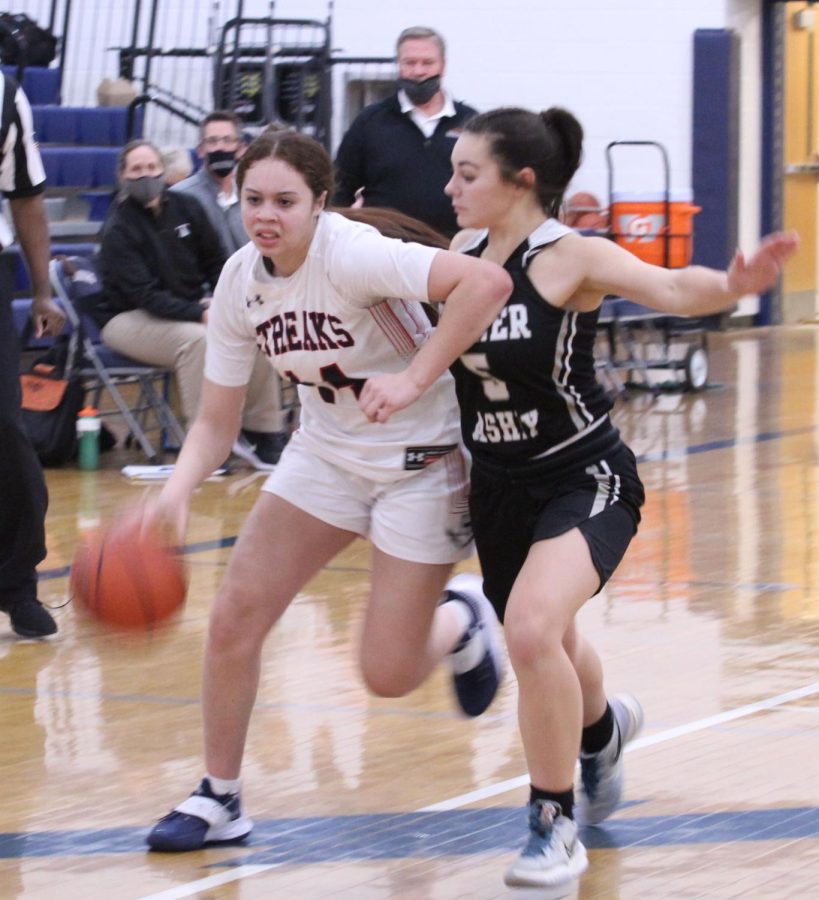 Senior Mariah Cain drives to the paint past her defender.