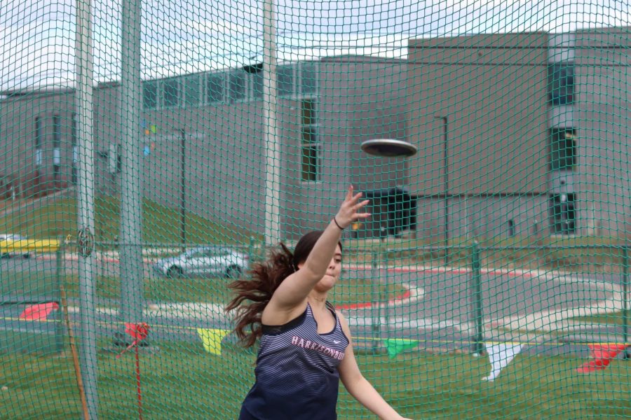 Freshman Ashley Diaz throws disc 43 feet at home track and field meet for her new PR. 